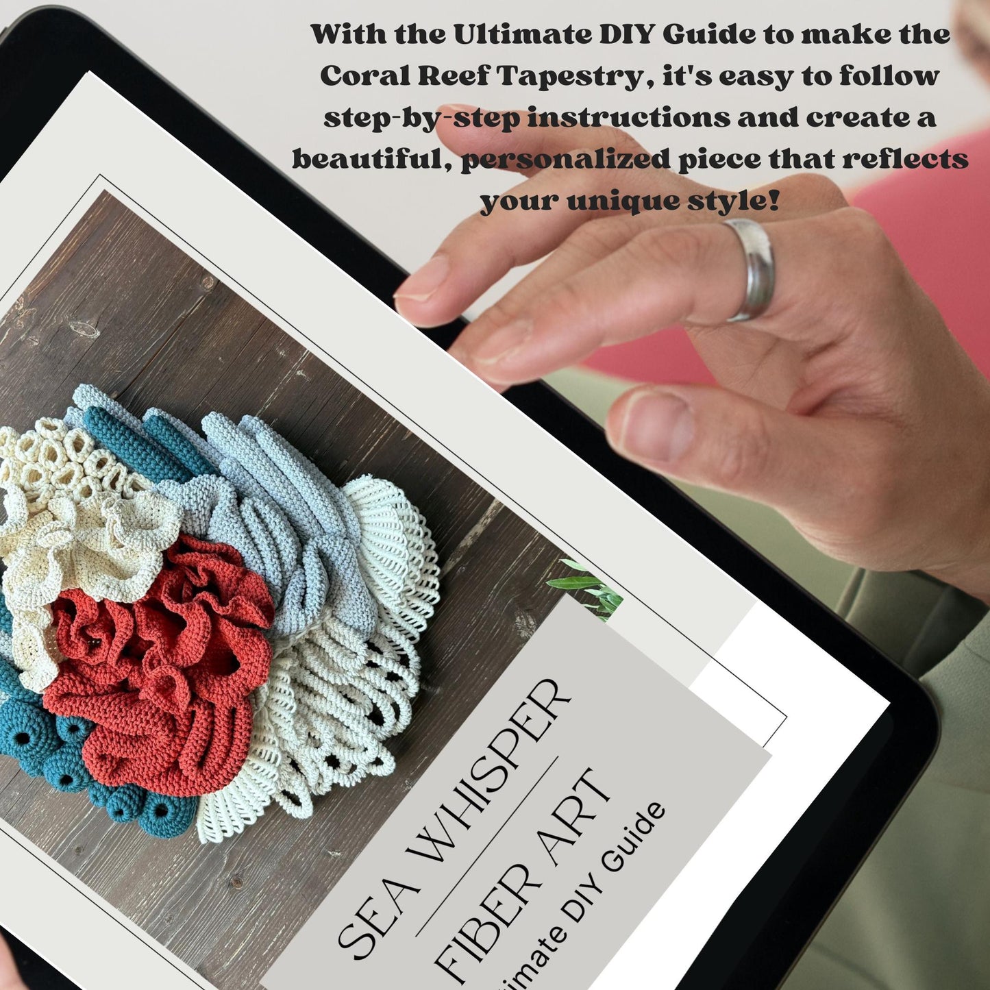 Person interacting with a tablet displaying a fiber art tutorial and finished coral reef tapestries.