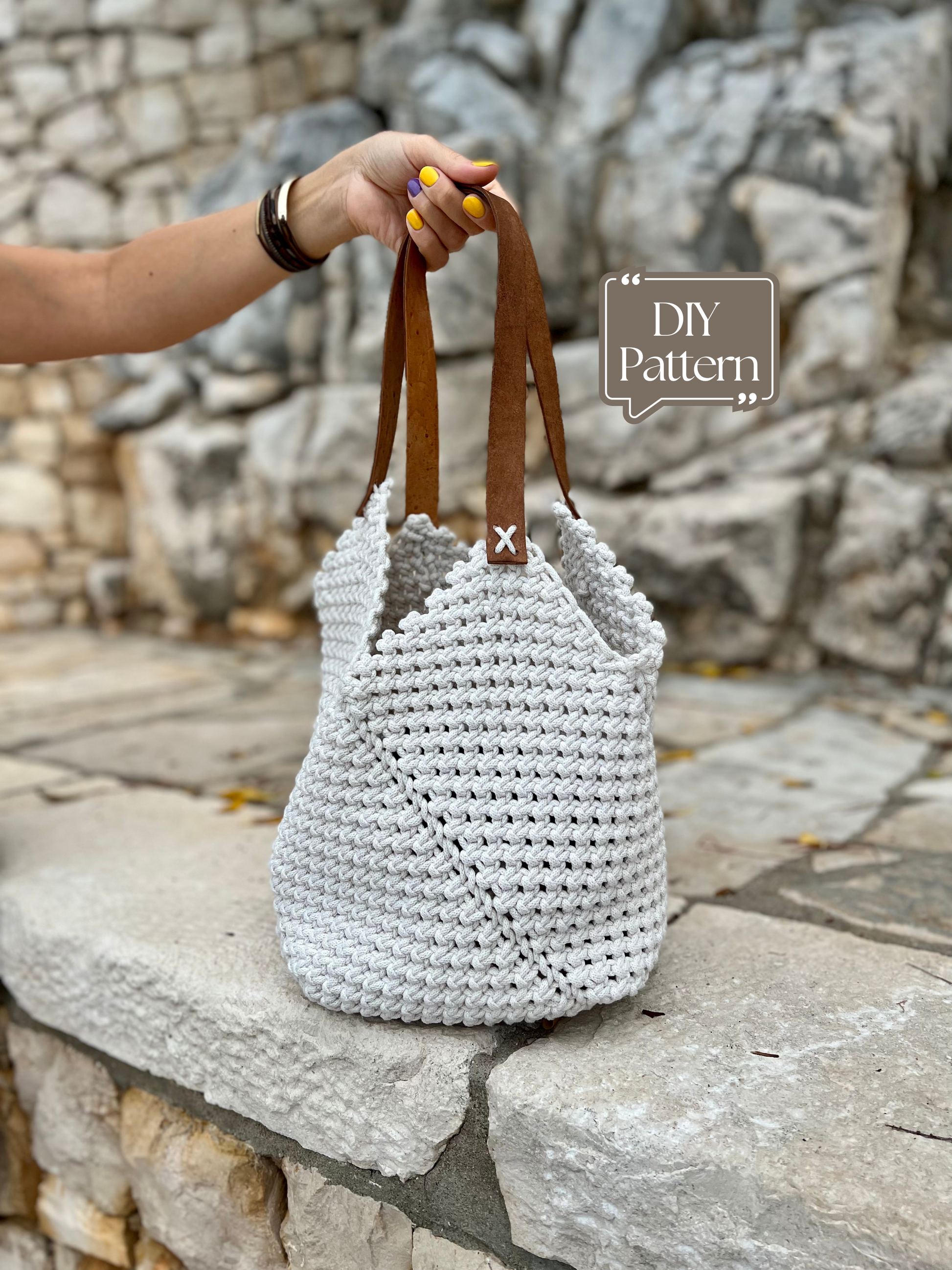 White woven bag with brown handles held by a hand against a stone wall background, with 'DIY Pattern' text overlay.