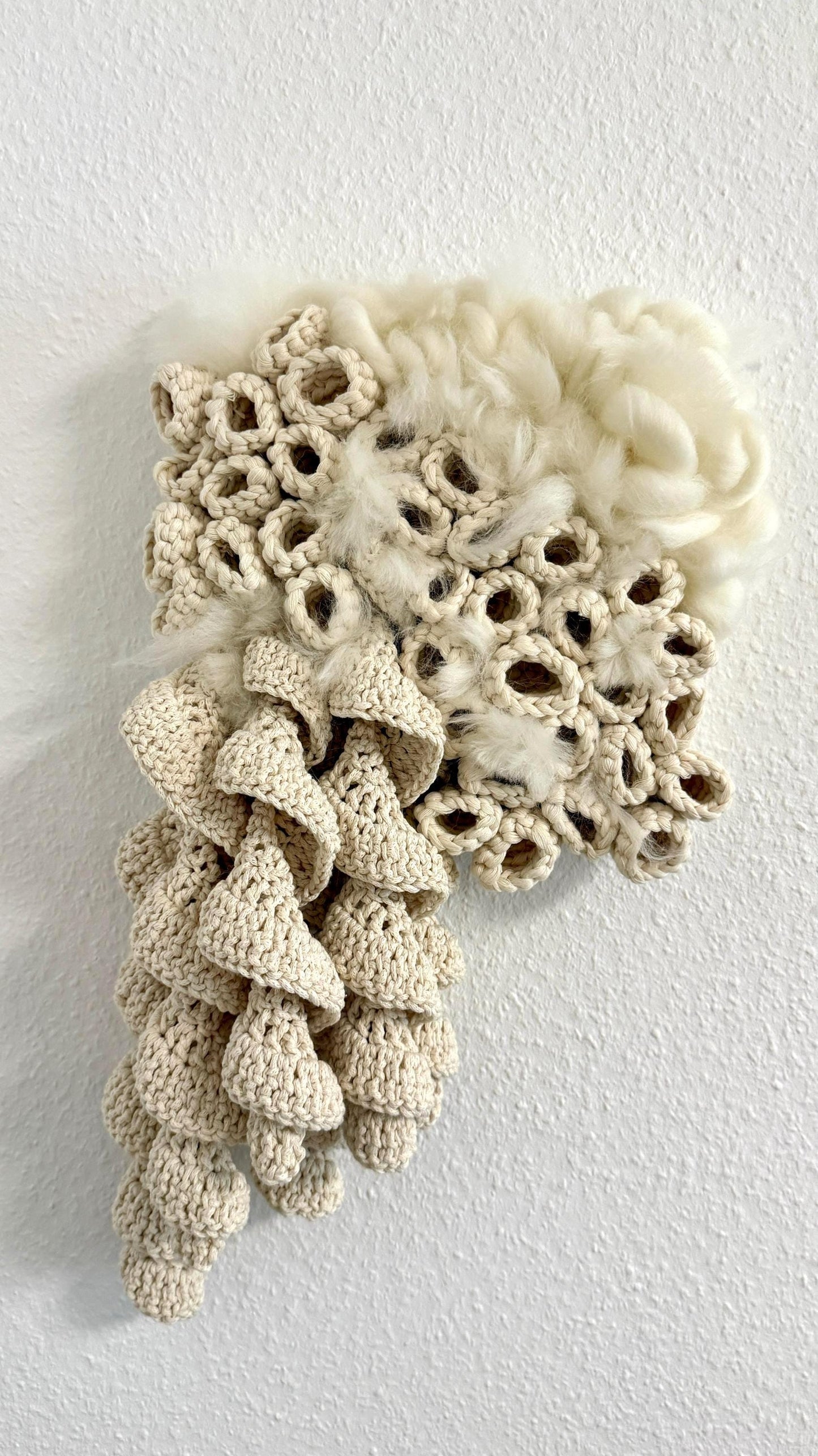 Crocheted decorative piece on a white background
