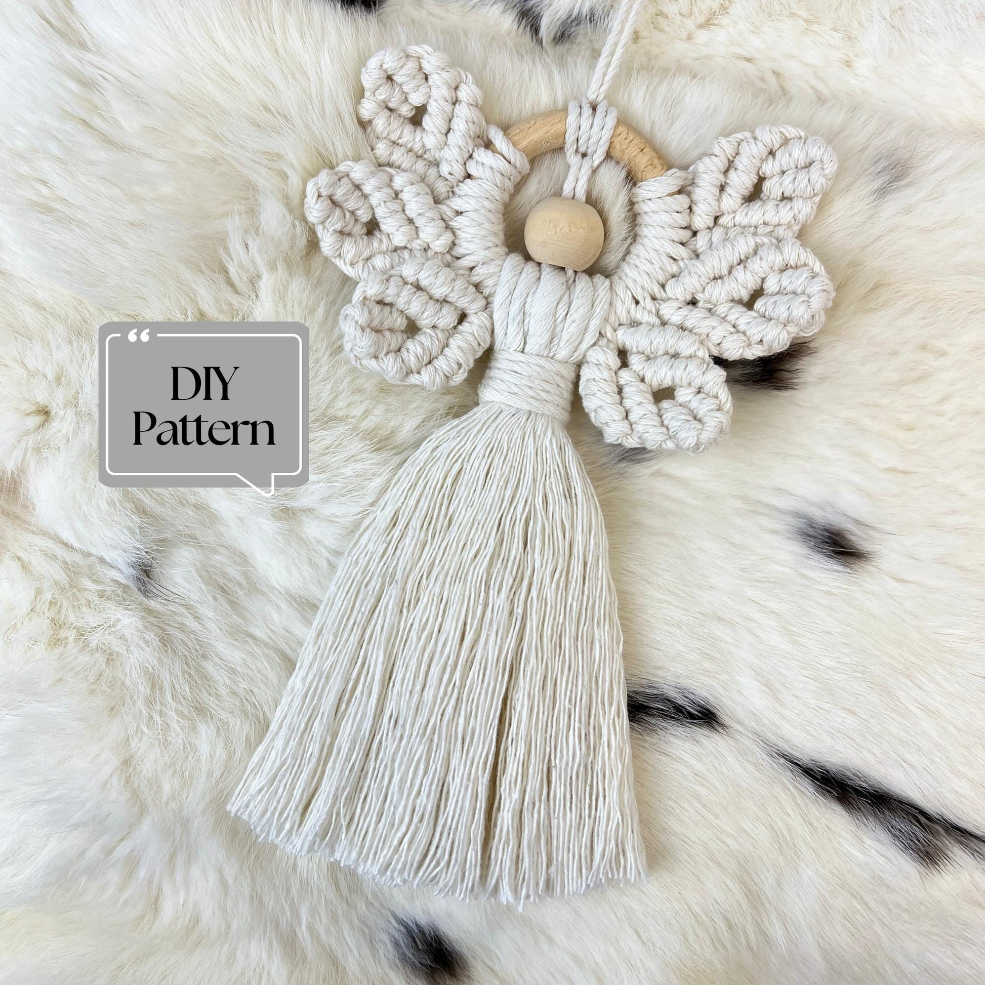 Macrame Christmas Angel with tassel on a fluffy white surface, featuring 'DIY Pattern' text.