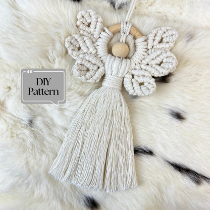 Macrame Christmas Angel with tassel on a fluffy white surface, featuring 'DIY Pattern' text.