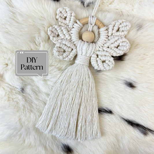 Macrame Christmas Angel with tassel on a fluffy white surface, featuring 'DIY Pattern' text.