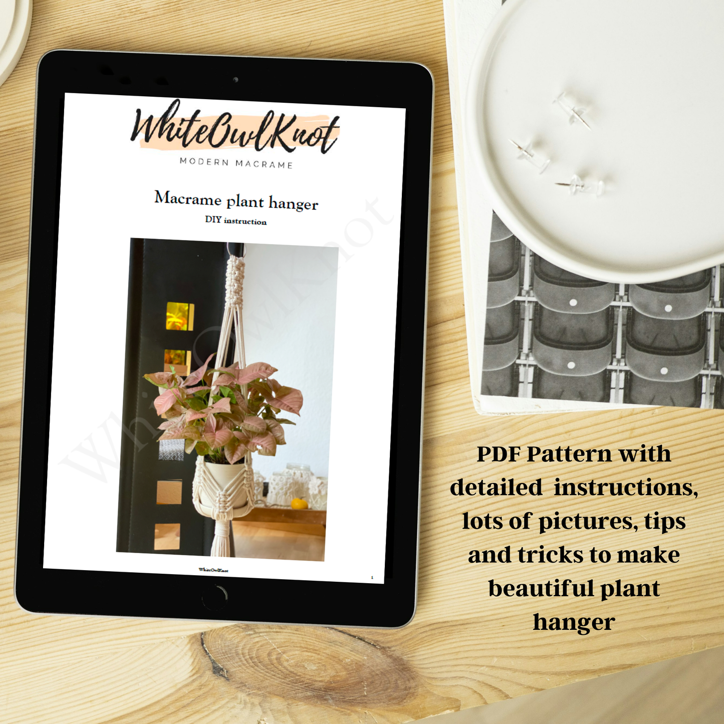 Tablet displaying a PDF pattern for a macrame plant hanger on a wooden surface.