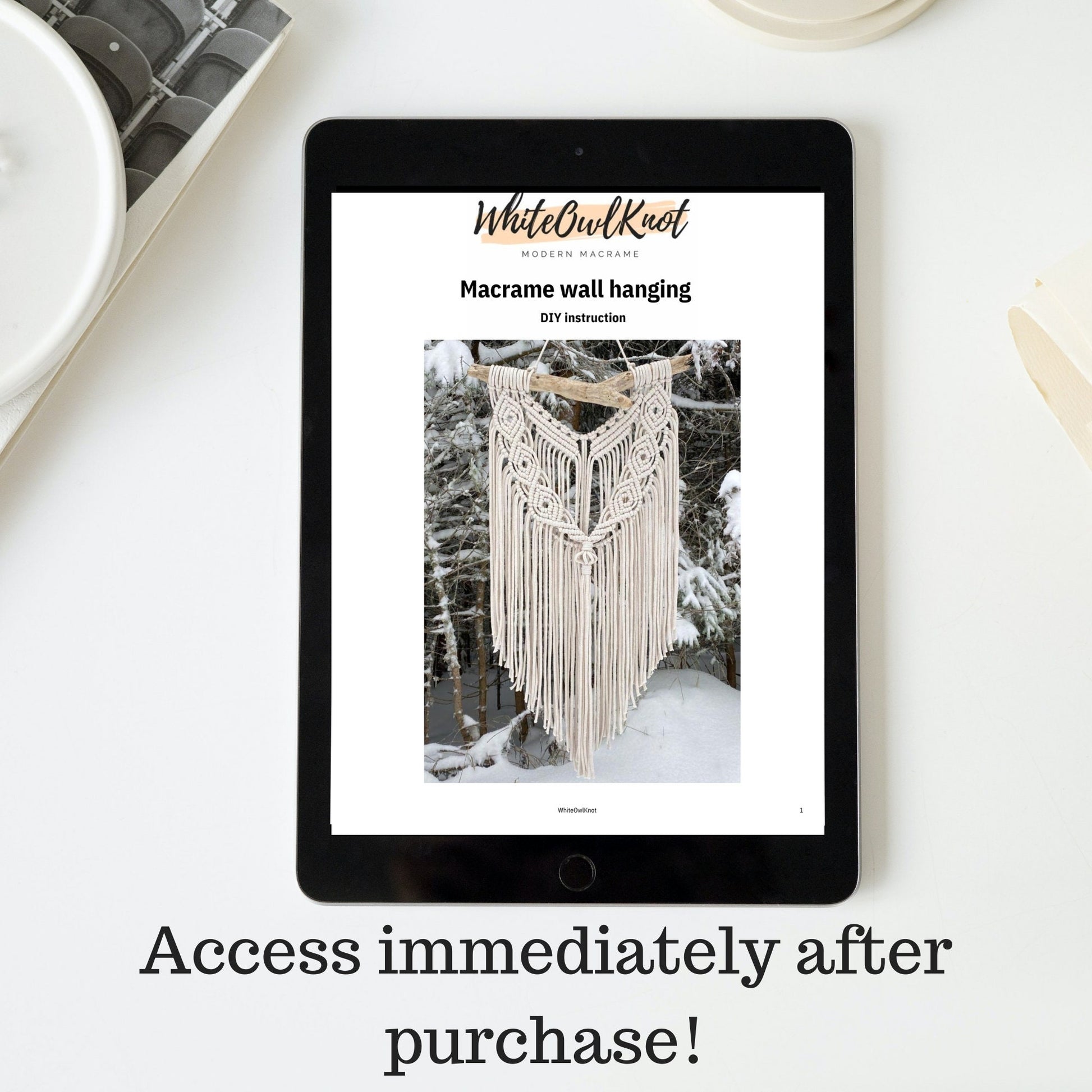 Tablet displaying a Macrame wall hanging DIY instruction on a white surface.
