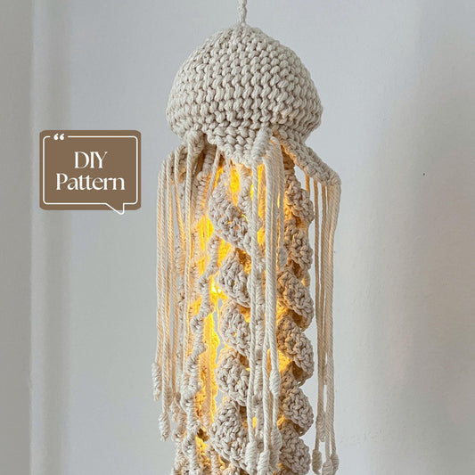 Macrame jellyfish lamp with glowing interior on a plain background, featuring 'DIY Pattern' text.