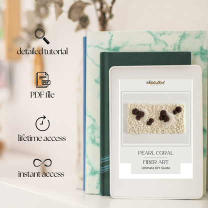 Pearl coral fiber art kit with a digital guide on a marble surface