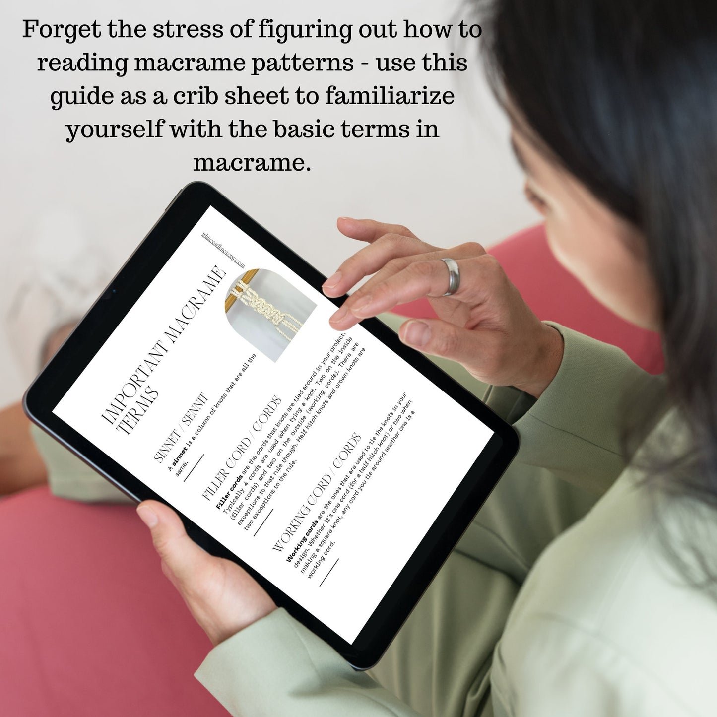 Person holding a tablet with a macrame guide on a white background