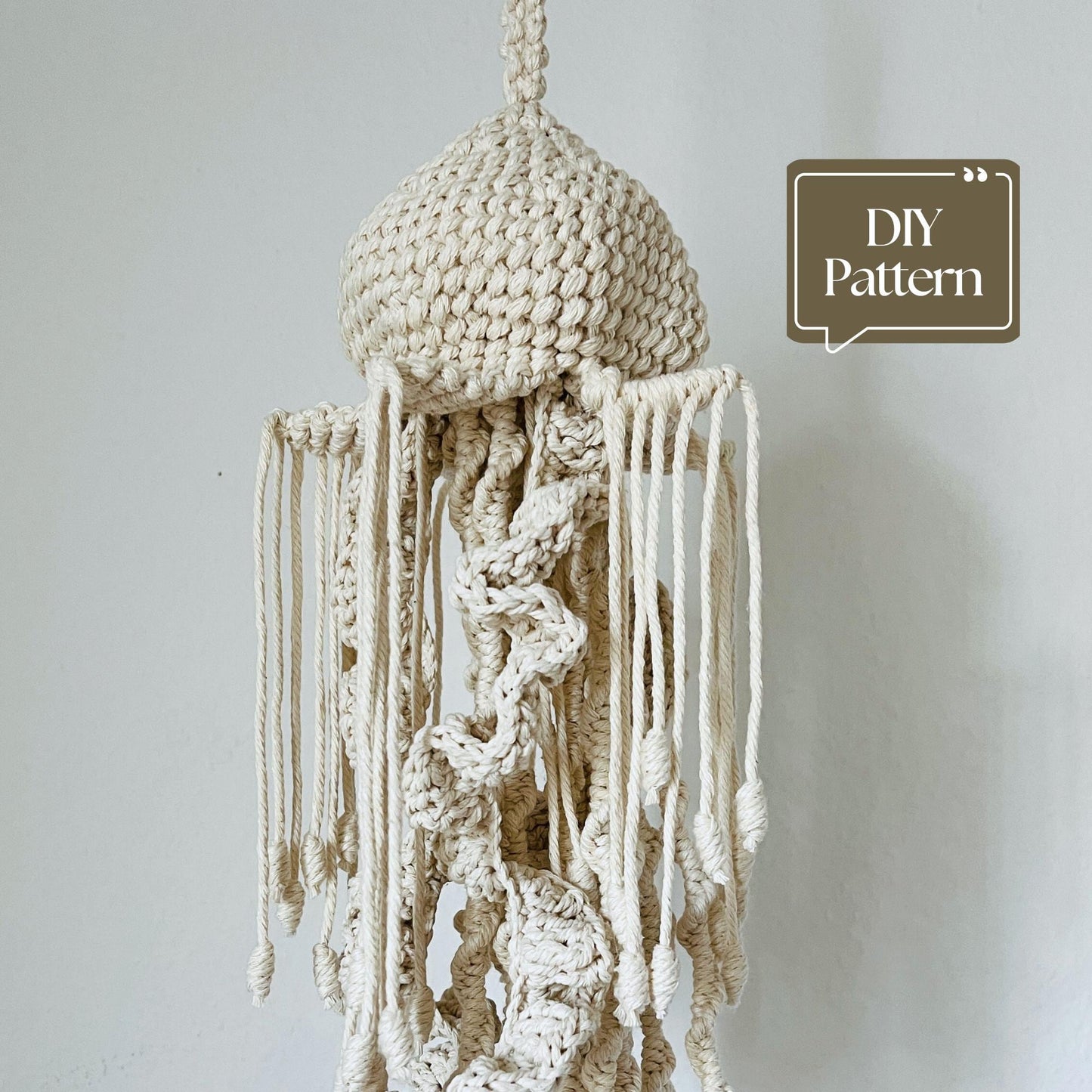 Macrame hanging decor Jellyfish with 'DIY Pattern' text on a plain background