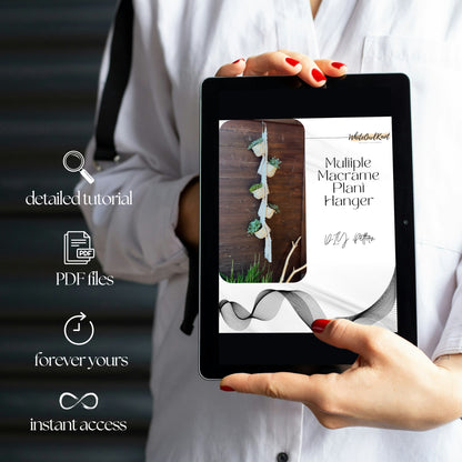 Person holding a tablet with a digital product on the screen, featuring text about a tutorial and PDF files.