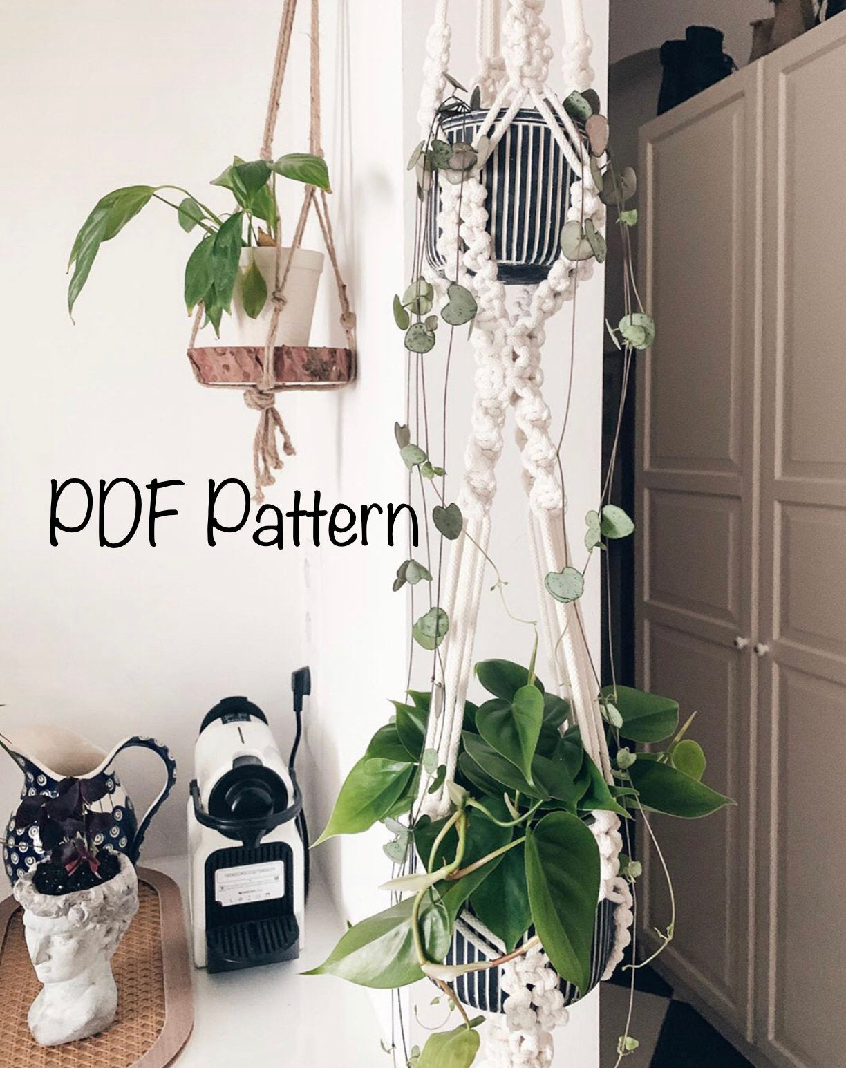 Macrame plant hanger with plants on a white surface, with text 'PDF Pattern' displayed.