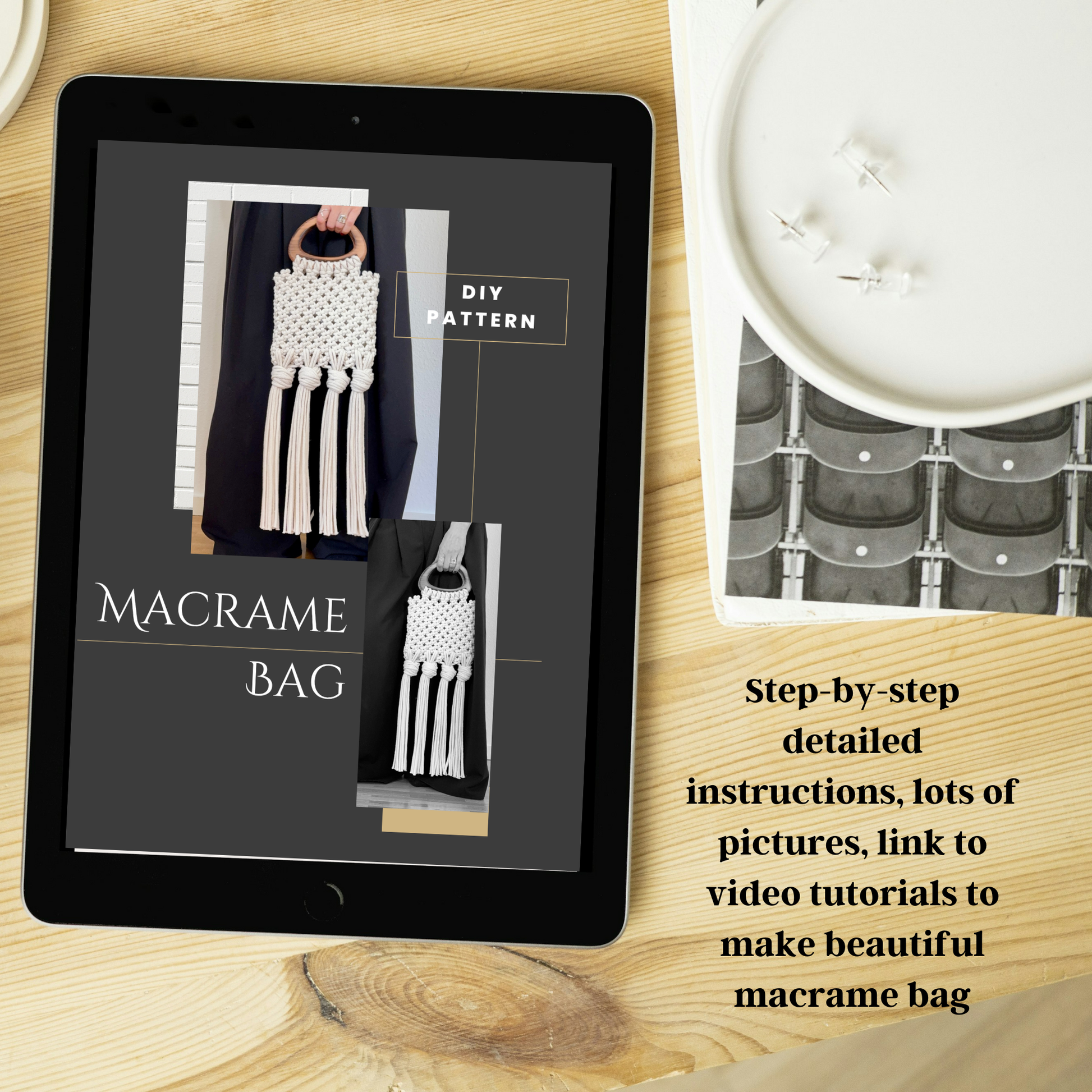 Tablet displaying a macrame bag pattern on a wooden surface with a candle and book.