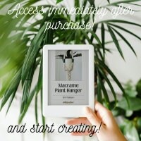 E-reader with a plant-themed cover held by a hand, surrounded by greenery.