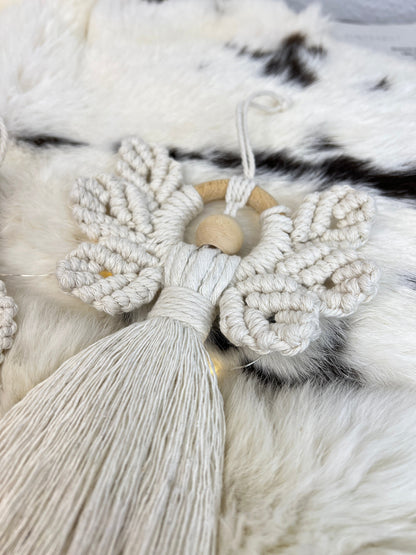 Macrame xmas angel with tassels on a fur surface