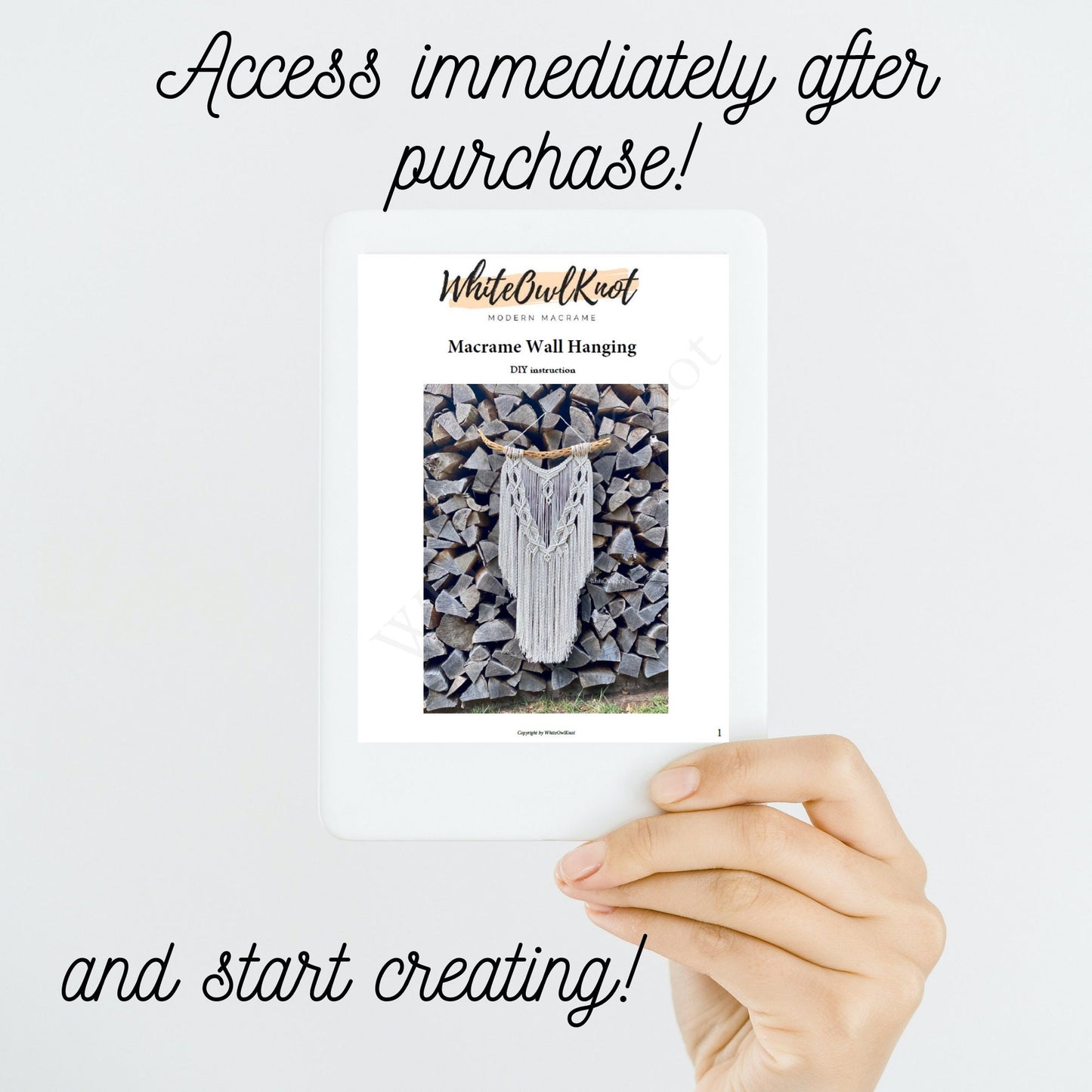 Hand holding a magazine with a macrame wall hanging on the cover against a white background.