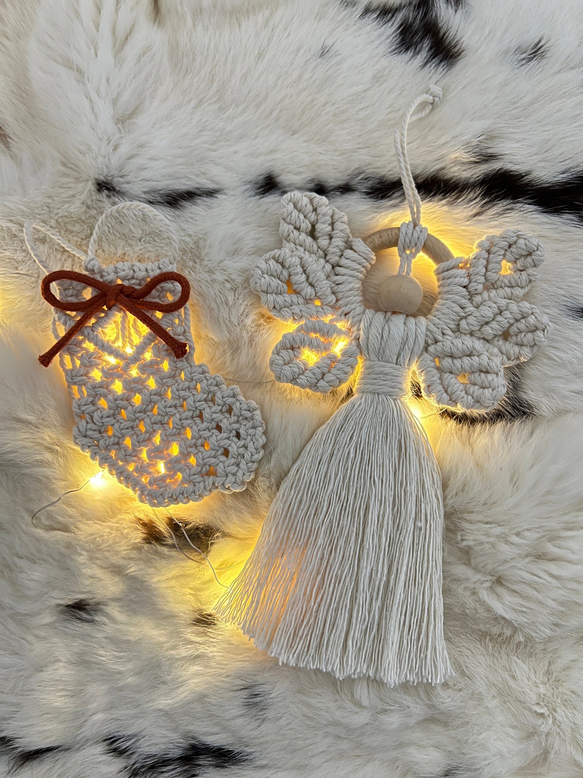 Decorative angel ornament and holiday stocking on a fur surface
