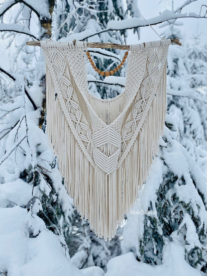 Macrame wall hanging in a snowy forest