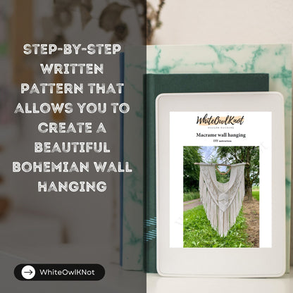 WhiteOwlKnot macrame wall hanging pattern book on a blurred background