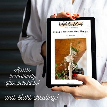 Person holding a tablet displaying a WhiteOwlKnot product with text about immediate access after purchase.