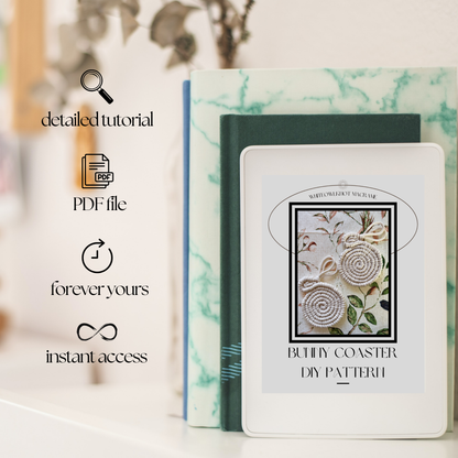 Book with DIY pattern design on a marble surface, featuring text about a detailed tutorial and PDF file.