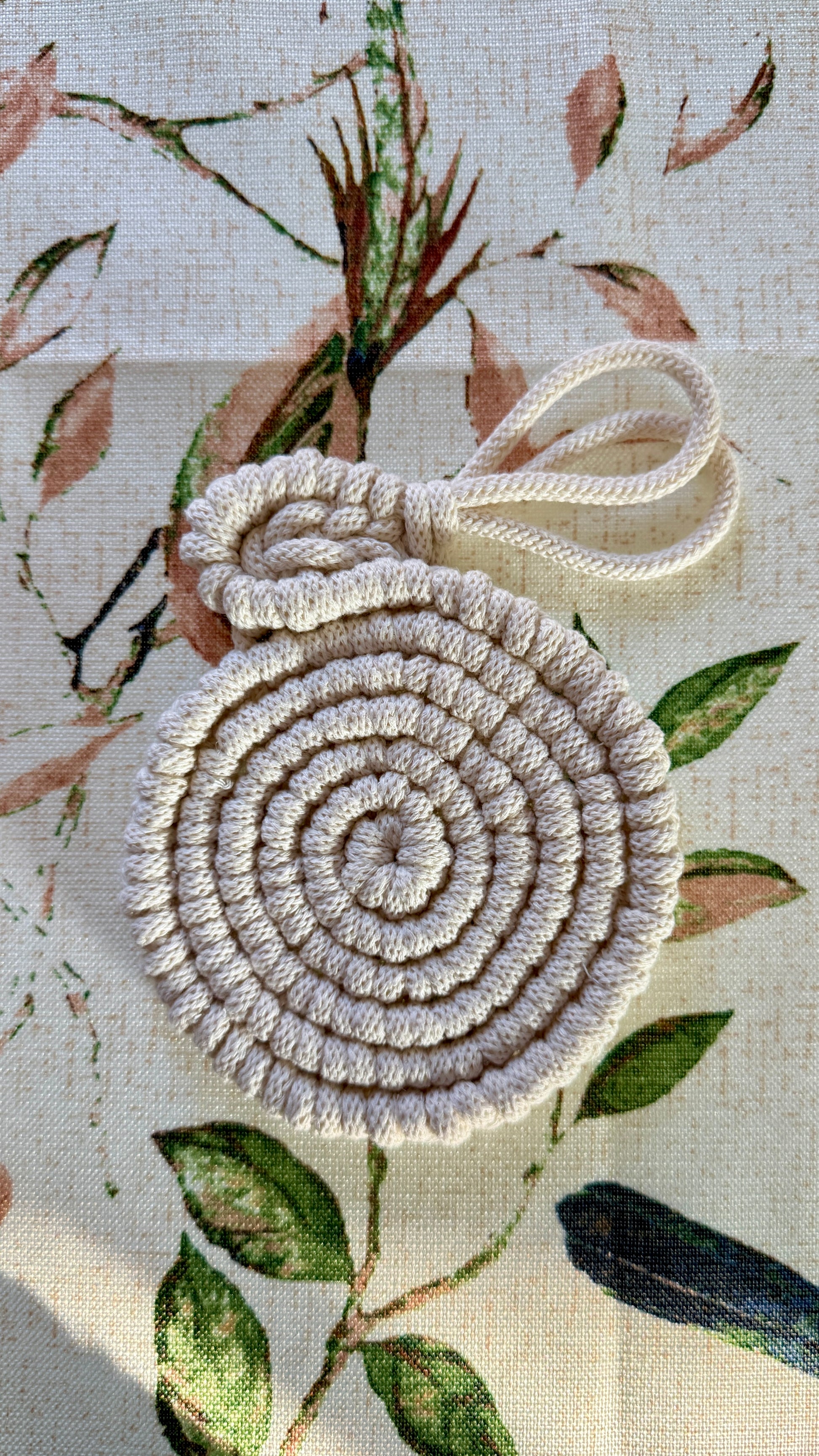 Decorative woven easter coaster with a floral background