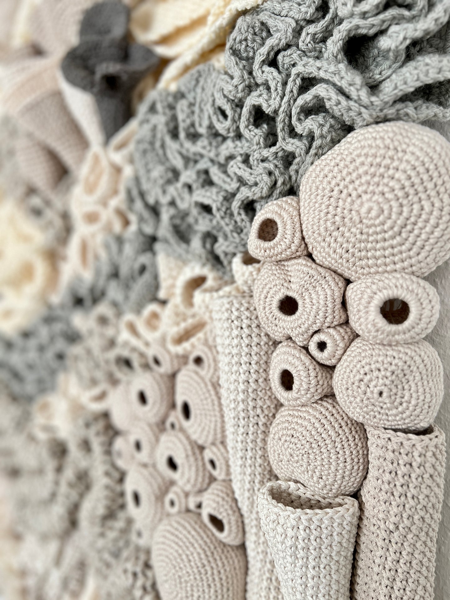 Textured wall art with organic shapes in neutral tones