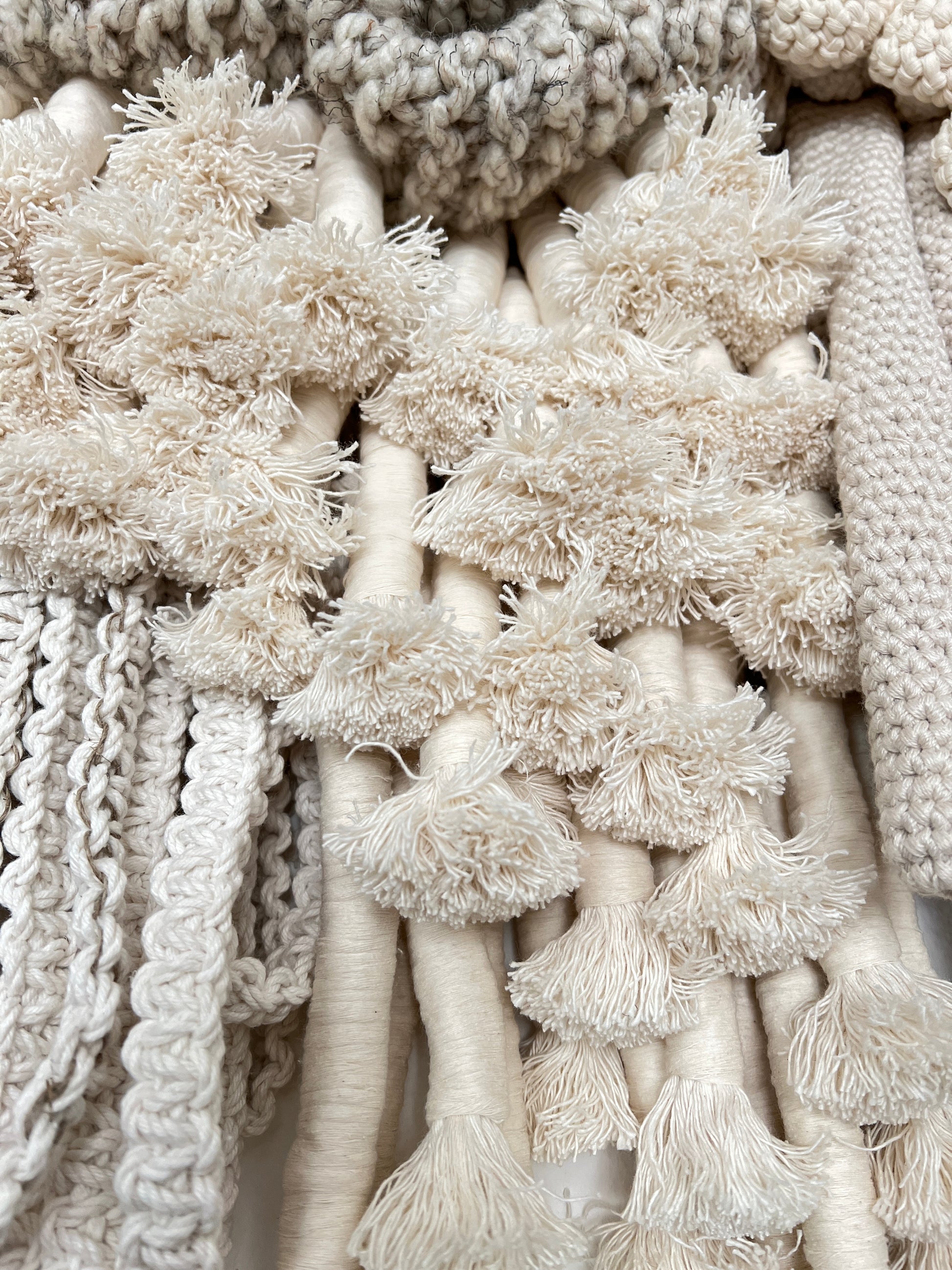 Close-up of textured beige fabric with various patterns