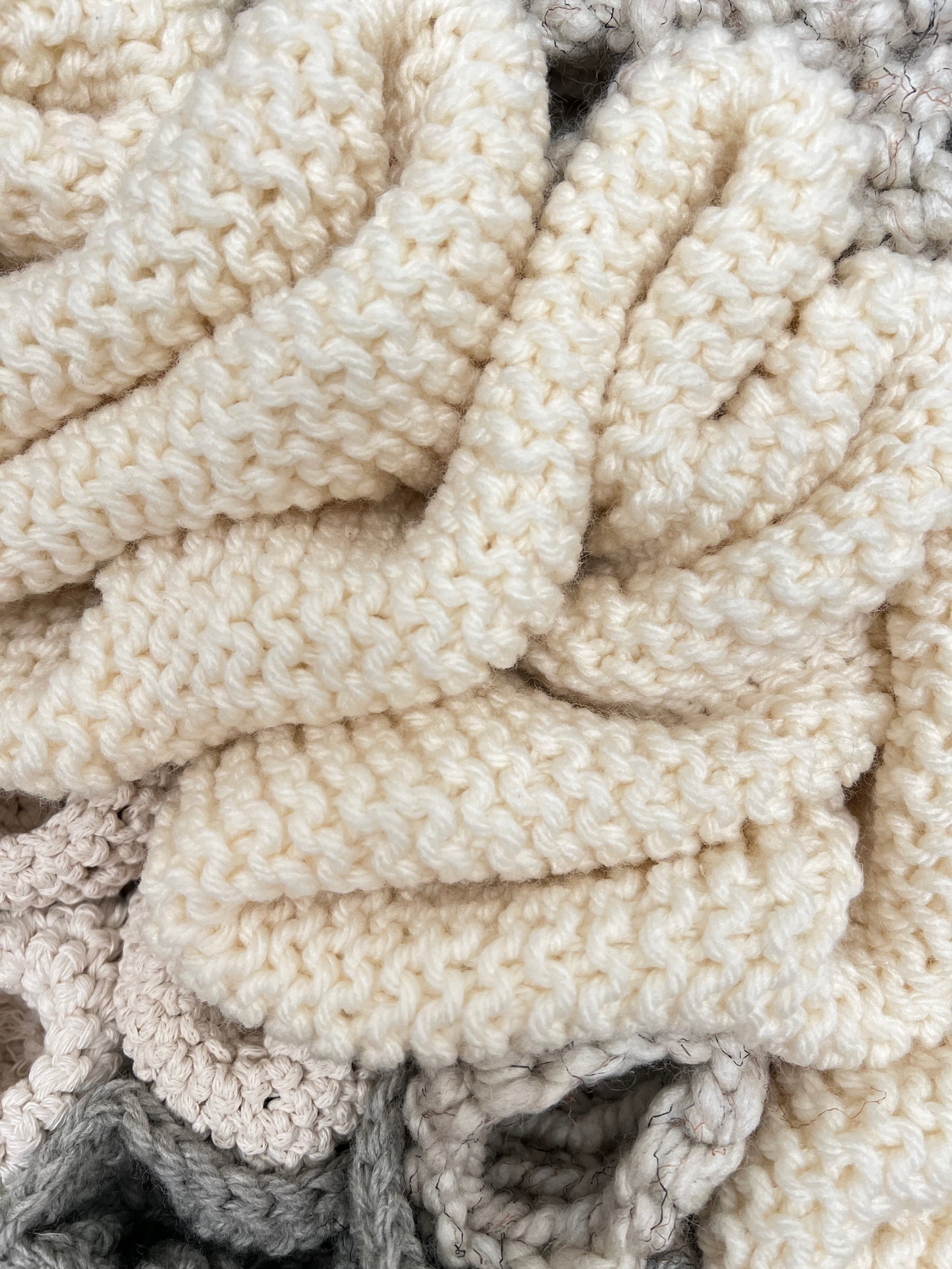 Close-up of textured white fabric with a subtle pattern