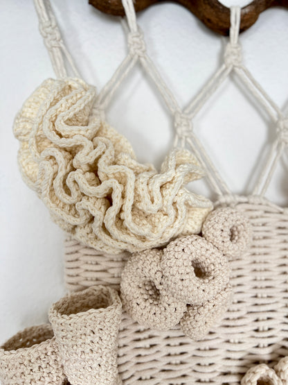 Macrame wall hanging with natural fibers on a white background