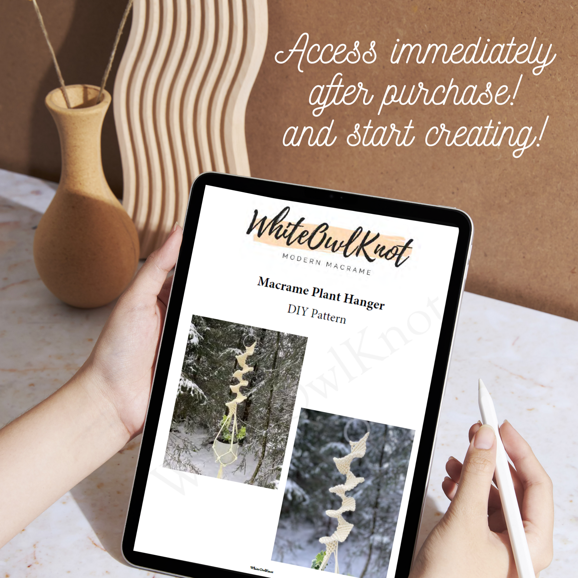 Person holding a tablet displaying a White Owl Knot macrame plant hanger DIY pattern.