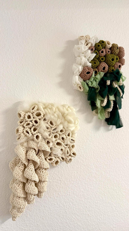 Two crocheted wall art pieces on a white background