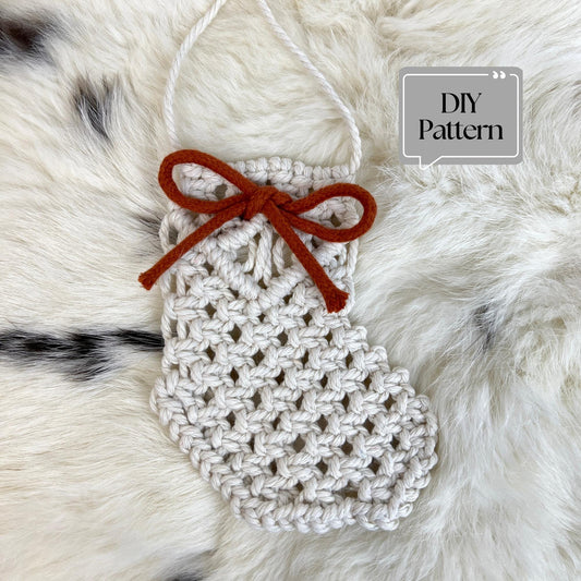 Macrame Christmas Stocking with a bow on a fur background, labeled 'DIY Pattern'.
