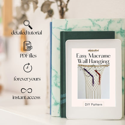 Macrame wall hanging DIY pattern book with digital download options on a blurred background
