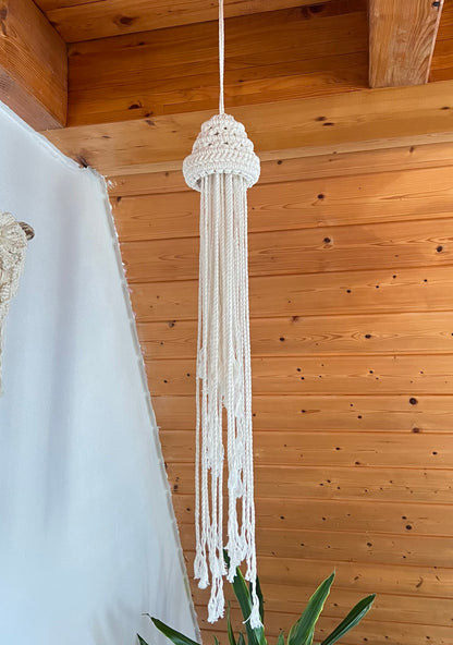 Macrame hanging decor against a wooden ceiling