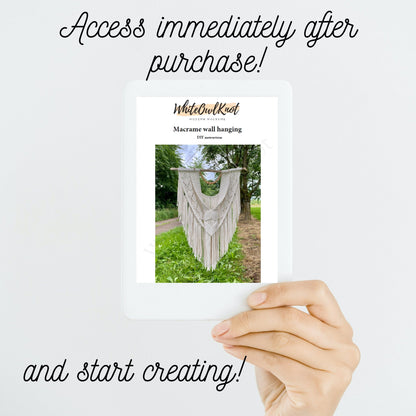 Hand holding a card with a macrame wall hanging image and promotional text on a white background
