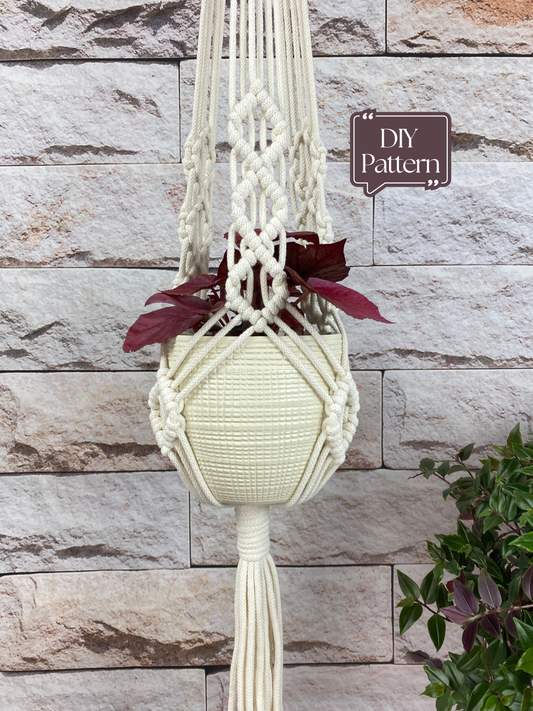 Macrame plant hanger with a plant against a stone wall background
