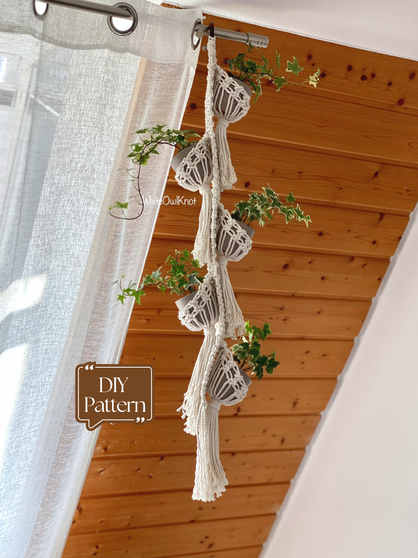 Macrame plant hanger with plants against a wooden wall