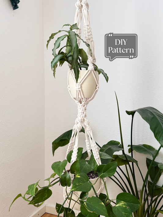 DIY double macrame plant hanger PDF pattern in natural cotton cord holding two white planters with green houseplants, boho hanging planter tutorial