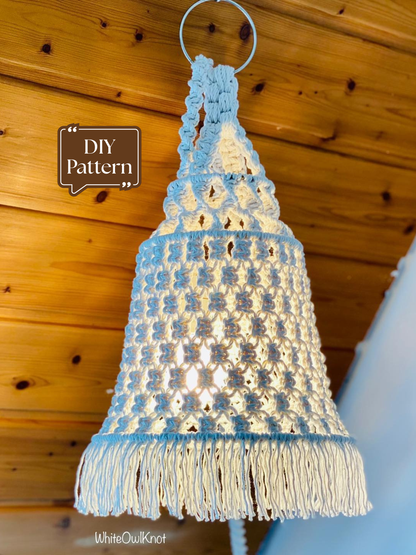 White macrame pendant lamp shade with fringe hanging from wooden ceiling, handmade boho lampshade DIY pattern 