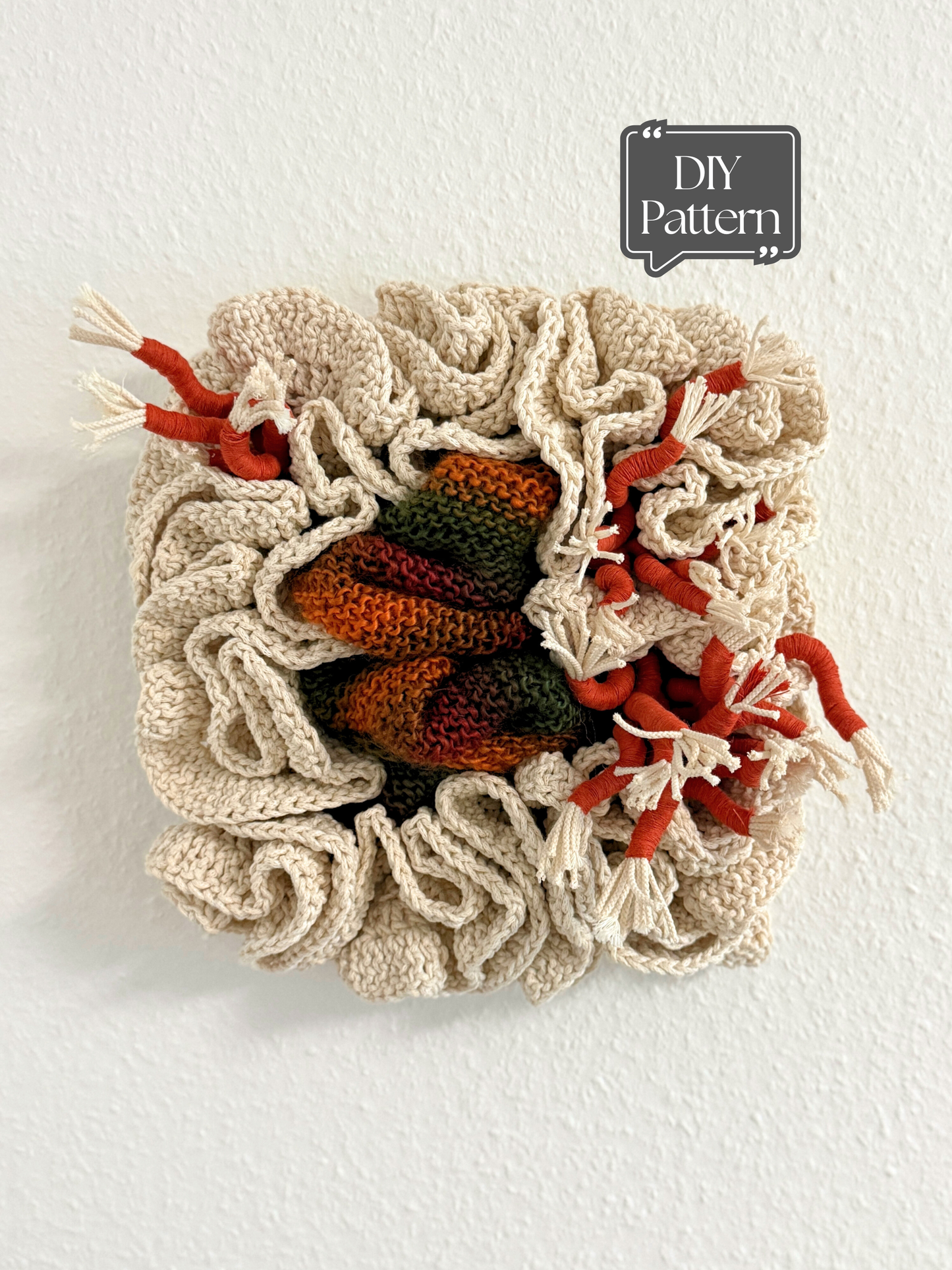 Crocheted fiber art on a textured beige background with 'DIY Pattern' text.