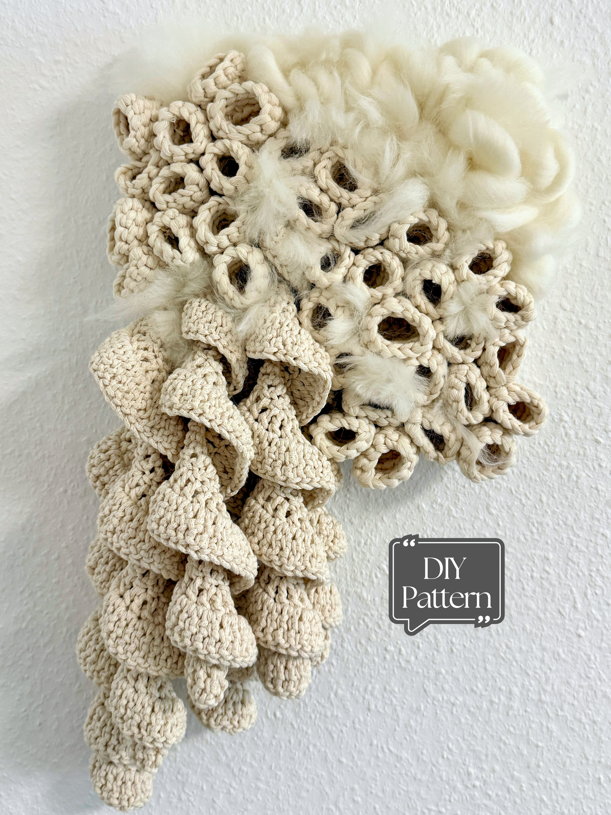 Crocheted coral pattern on a textured white background with 'DIY Pattern' text.
